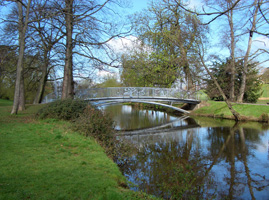 PITTVILLE PEDESTRIAN COMMUNITY BRIDGE - 2012 - Pittville Park, Cheltenham - Span 21.5M (70’). Client: Cheltenham Borough Council. DISTANT VIEW, EAST ELEVATION. Designed  & made by Christopher Lisney (with community groups input, & large scale fabrication, Longhope Welding). Copyright Chistopher Lisney 2014 - All Rights reserved by DESIGN PROTECT