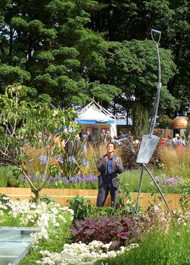 BBC filming Monty Don with 3 Balancing Spades. RHS Tatton Park - Height 3.8M (12’). Client: Cancer Research UK - Show Garden. Copyright Chistopher Lisney 2014 - All Rights reserved by DESIGN PROTECT